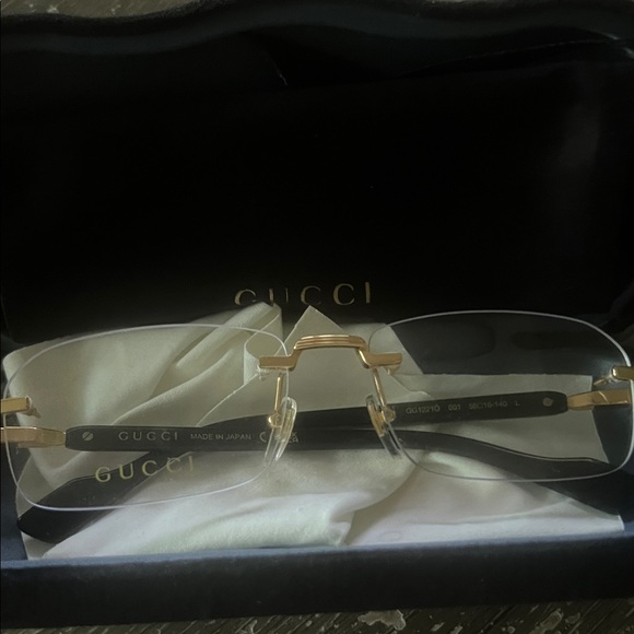 Gucci Rimless Glasses with Gold and Black Accents - Picture 1 of 4